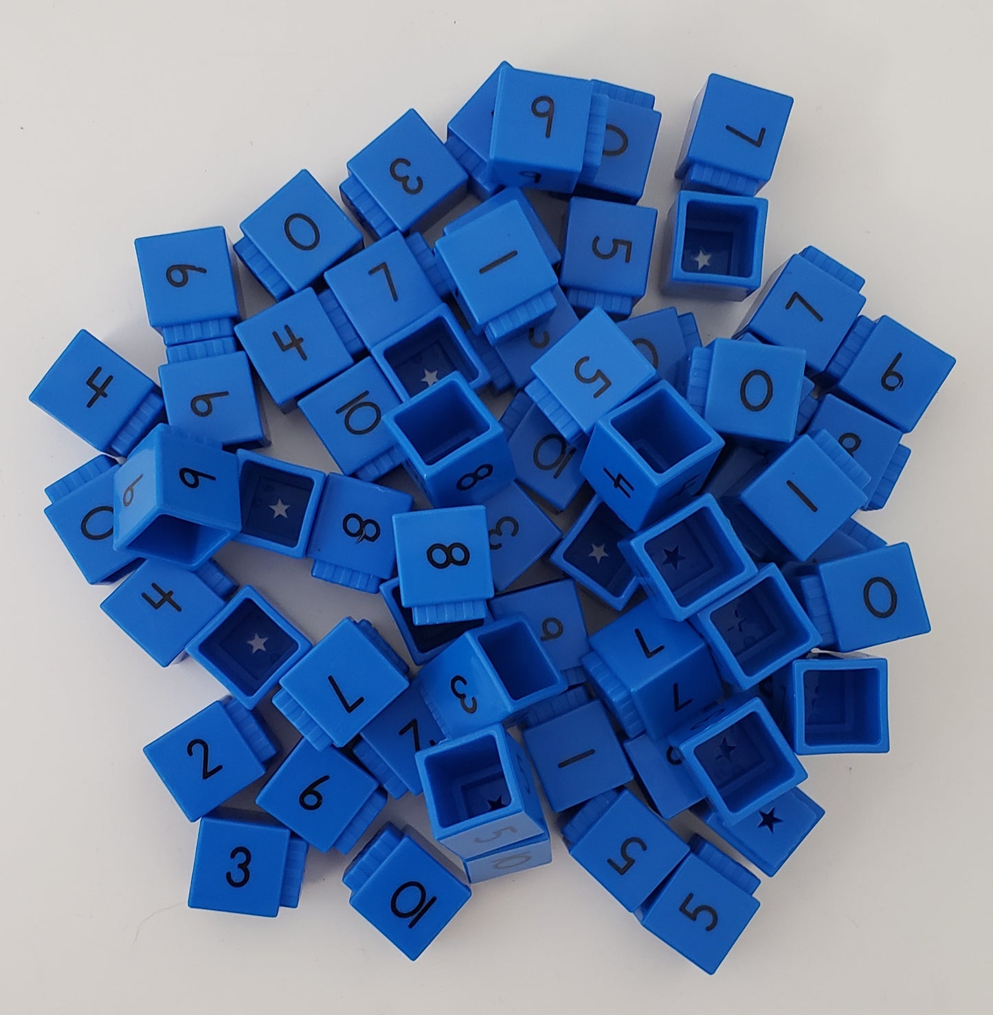 Stacking number cubes with numbers on them (approx. 50)