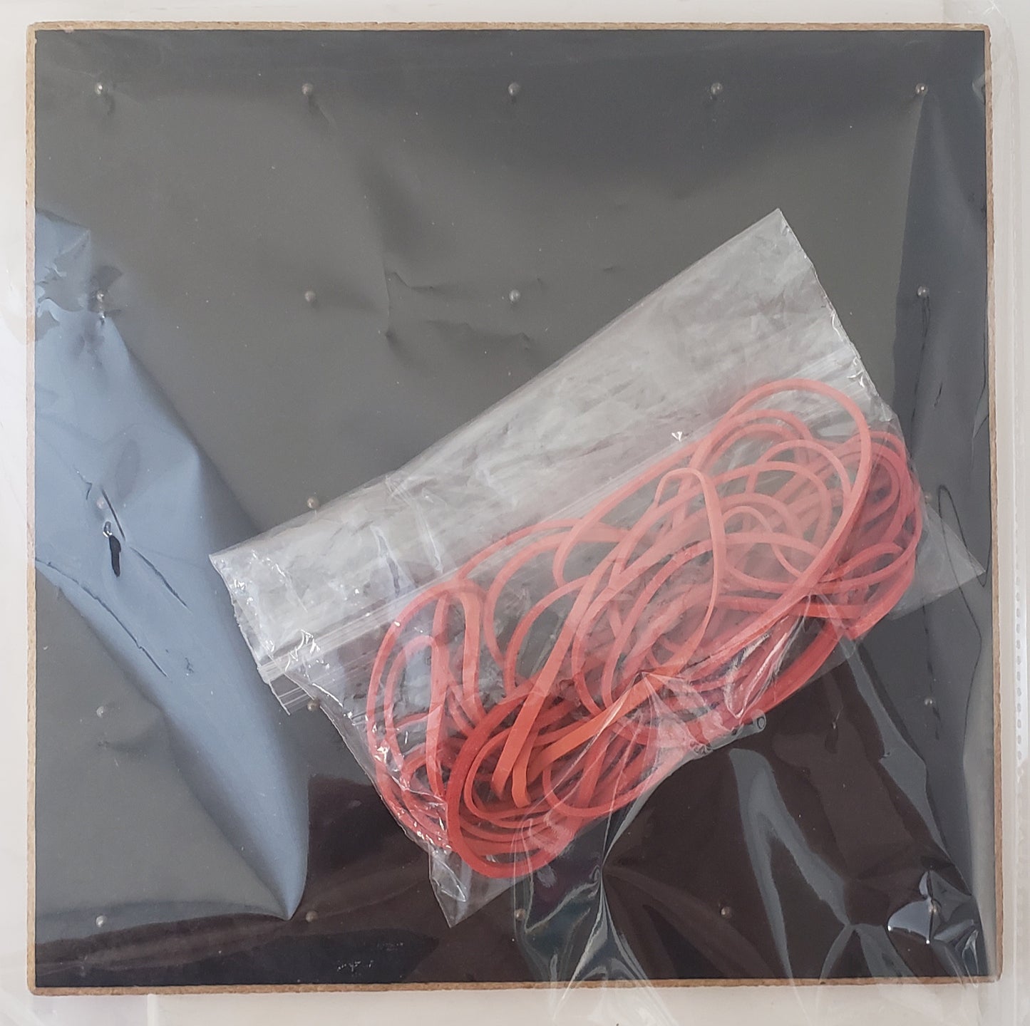 Geoboard with rubber bands and Teacher's Manual